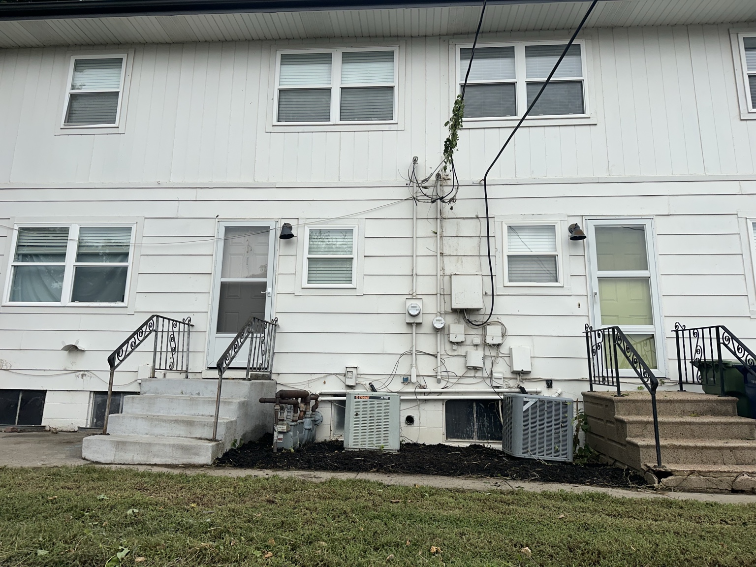 Rear exterior after large-scale overgrowth cleanup